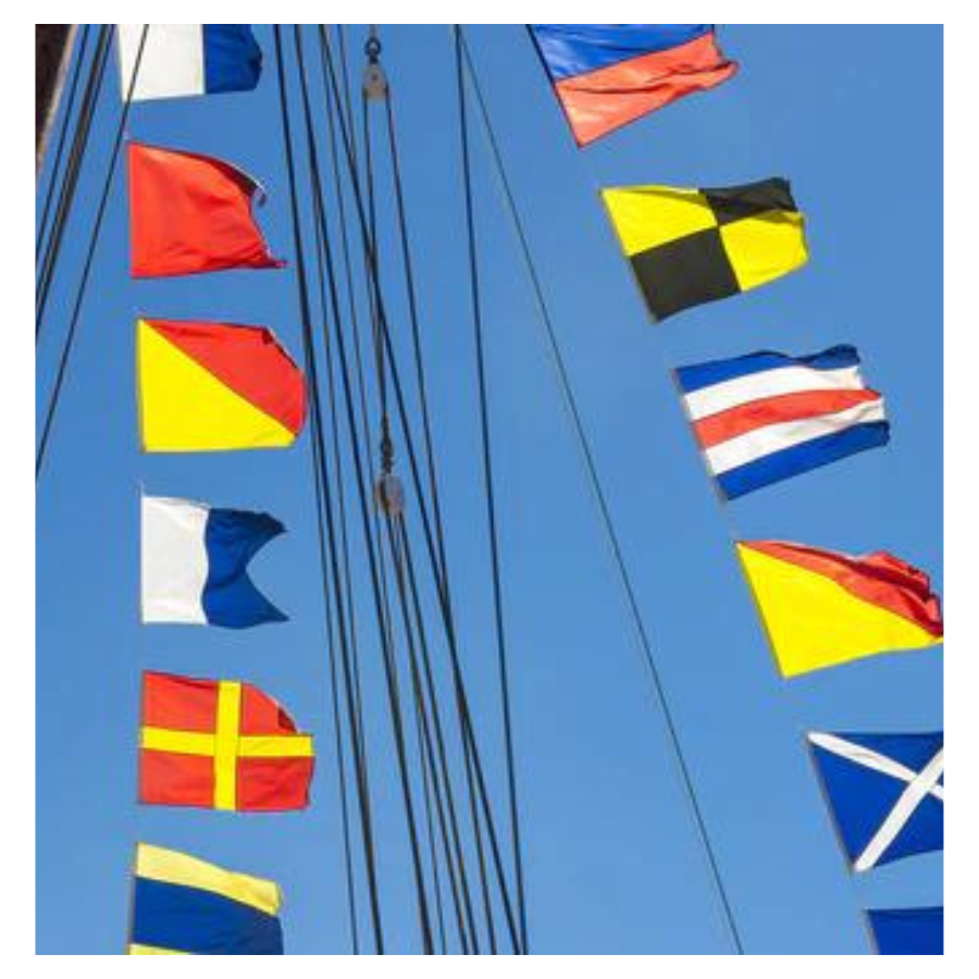 The Colorful Language of the Sea: A Brief History of Nautical Flags–and Our New Bangle!