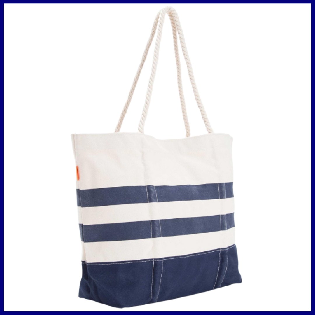 Eighteen ounce canvas bag.  Top quarter of tote is natural color then 2 navy stripes that look weathered.  The bottom quarter of the bag is navy block.    Rope handles make the bag look nautical. 